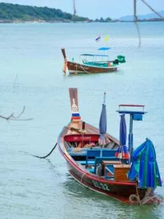 Traditional Thai fishing boat in clear blue water