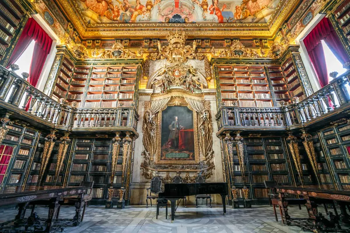 The ornate interior of Biblioteca Joanina library in Coimbra Portugal.
