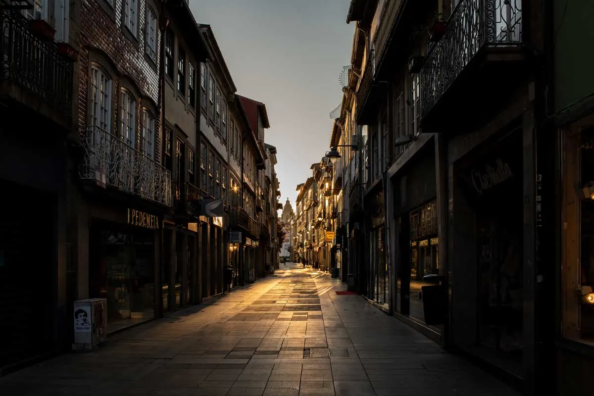 Reflections on the main pedestrian street in Braga Portugal at sunrise. 