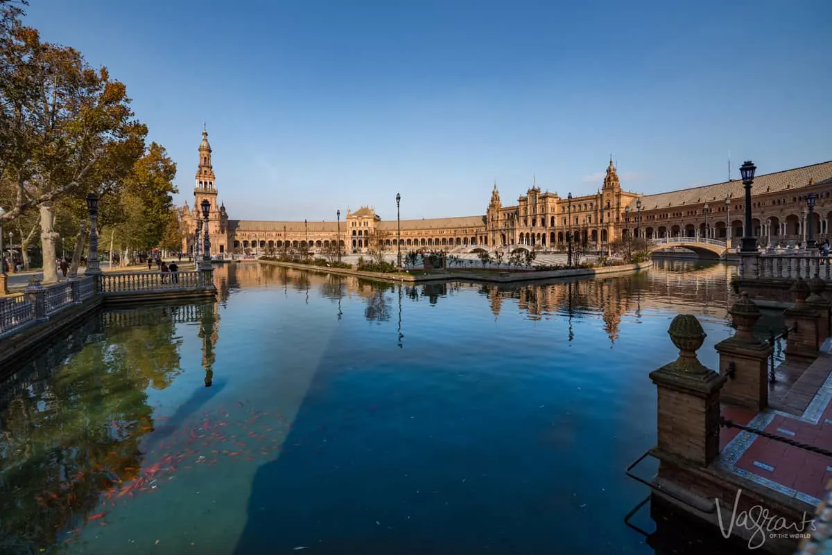 Looking accross the water in Plaza Espana in Seville.