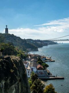Views over the Tagus River and Cristo Rei statue in Lisbon.