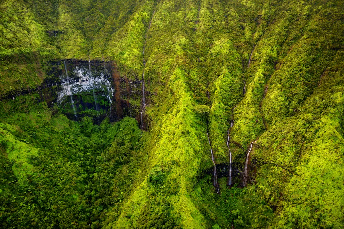 The lush green valleys with waterfalls on Mt Waialeale Hawaii.