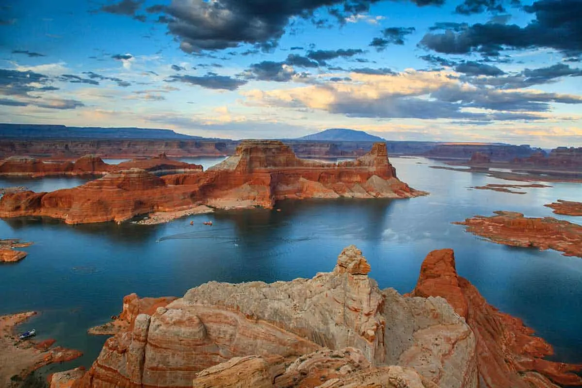 Sunset over the blue water and red rocks of Lake Powell Arizona. 