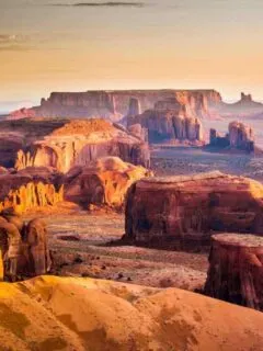 Sunset over the red rock landscape of the Monument Valley in Arizona.