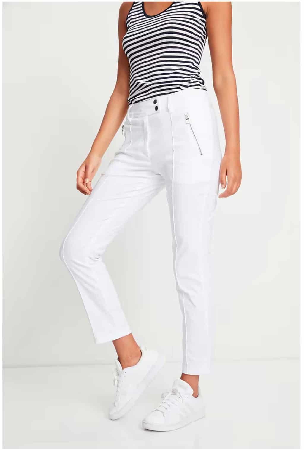 Woman modelling white Anatomi travel pants with a striped top.