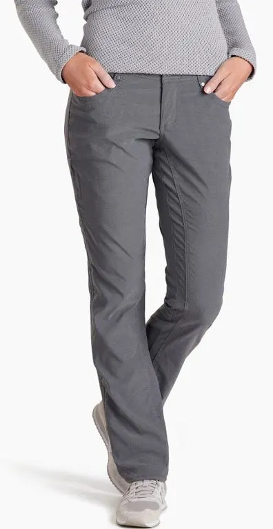 Woman from waist down modelling a pair of grey trekking travel pants.
