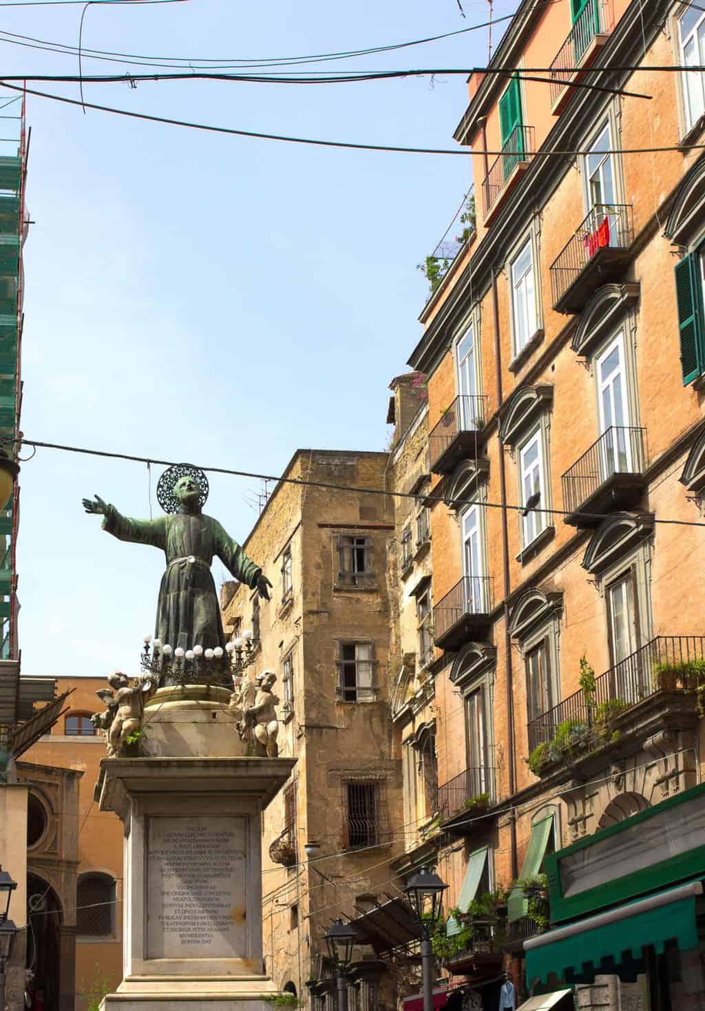 A statue of a saint looking to the sky in Piazza San Gaetano in Via dei Tribunali in Naples. 