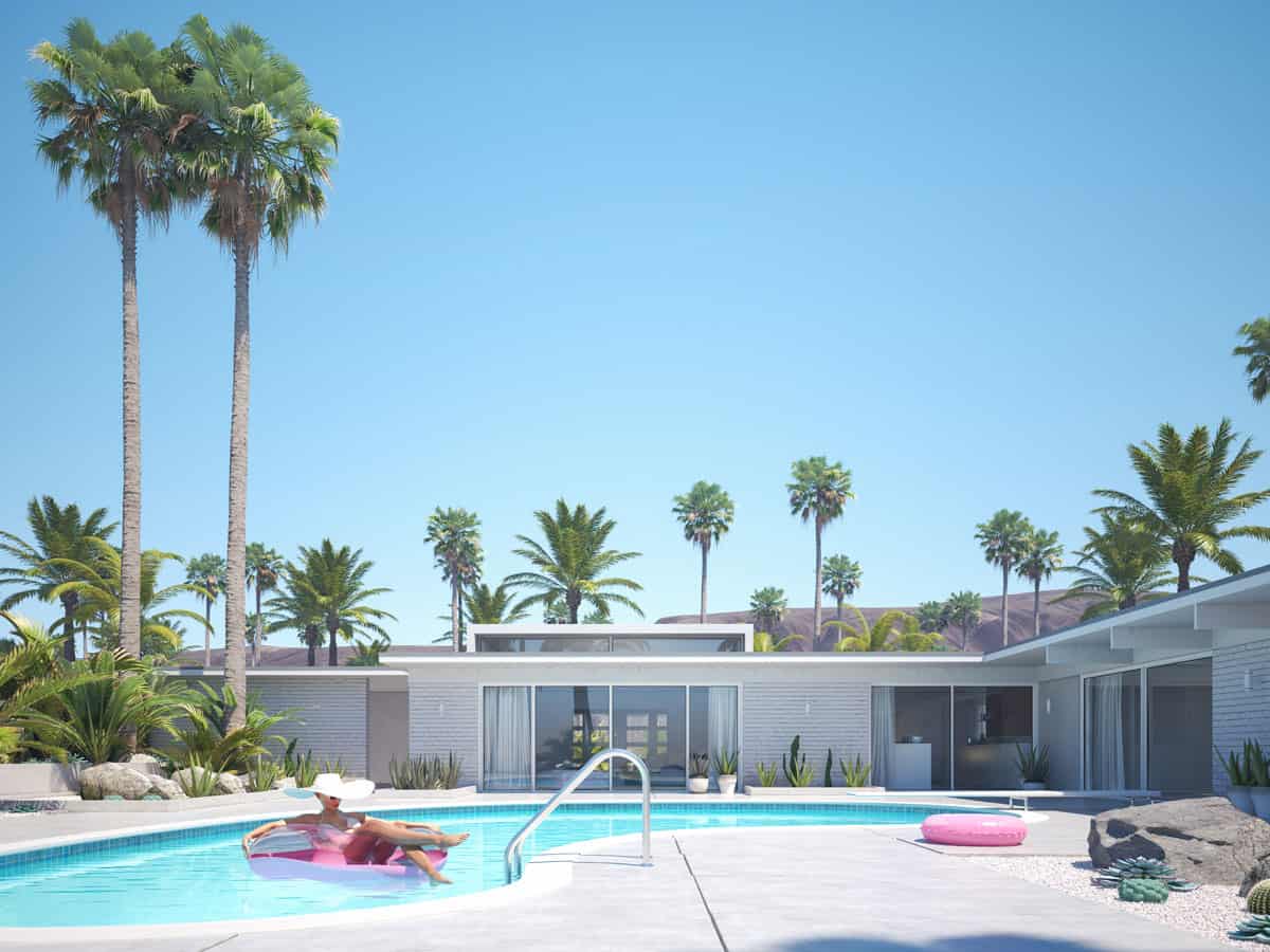 A woman floating in a pool on a pink tube wearing a big sun hat in front of a mid century house in Palm Springs