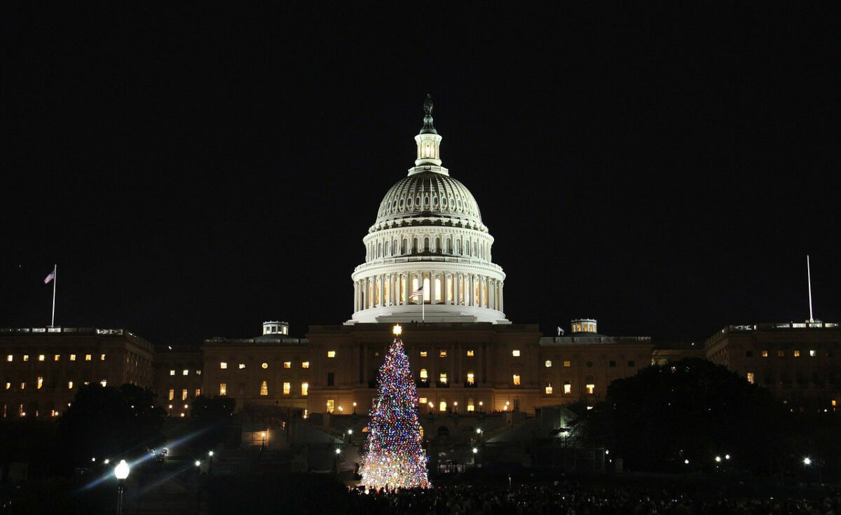 Washing DC At night with the national Christmas tree lit up in front of the Capitol Building. 