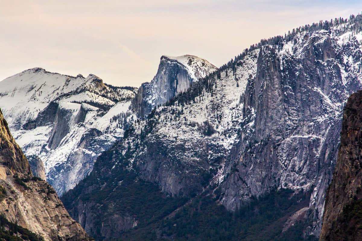 Snow covered grantite peaks in Yosemite National Park at winter time. 