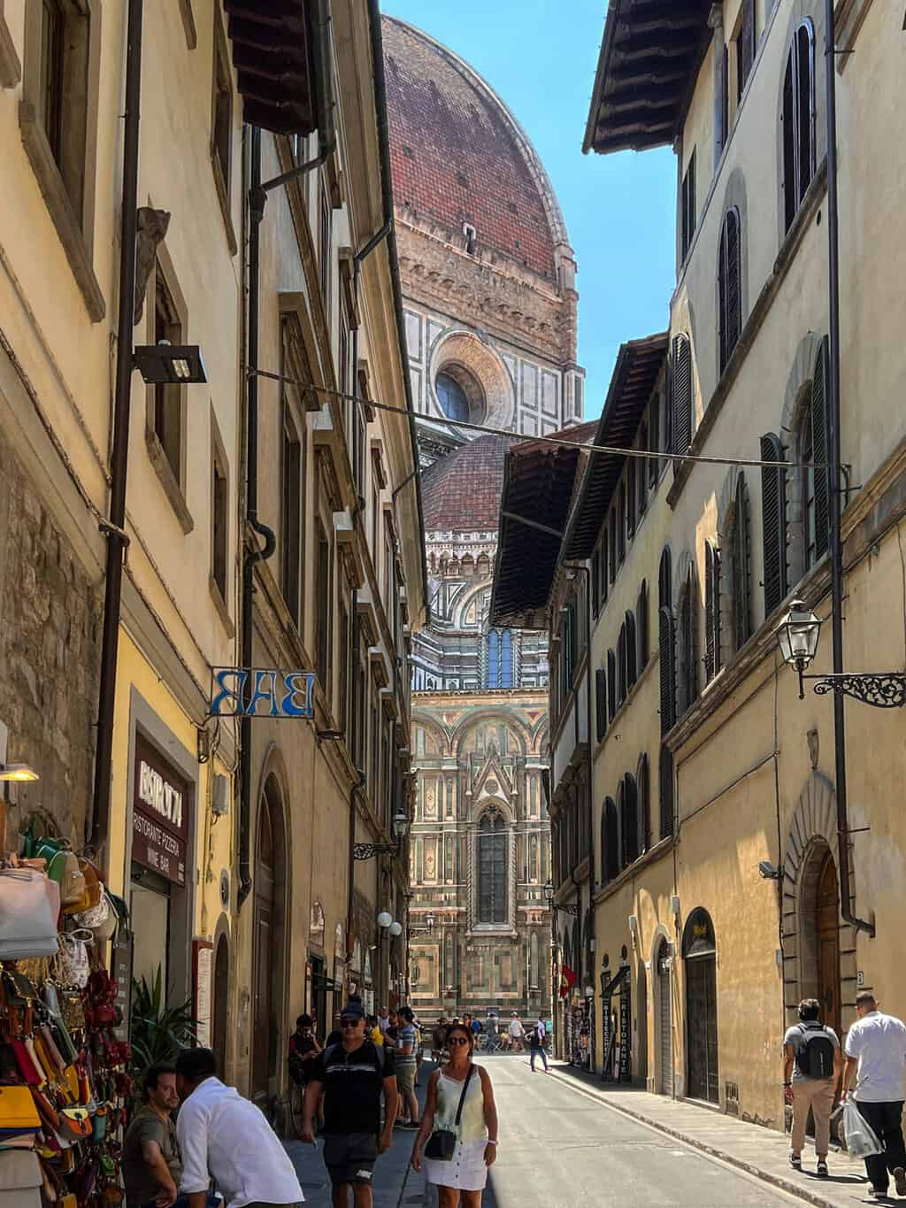 At the end of a narrow street in Florence you can see the enormous dome of the Florence Cathedral.