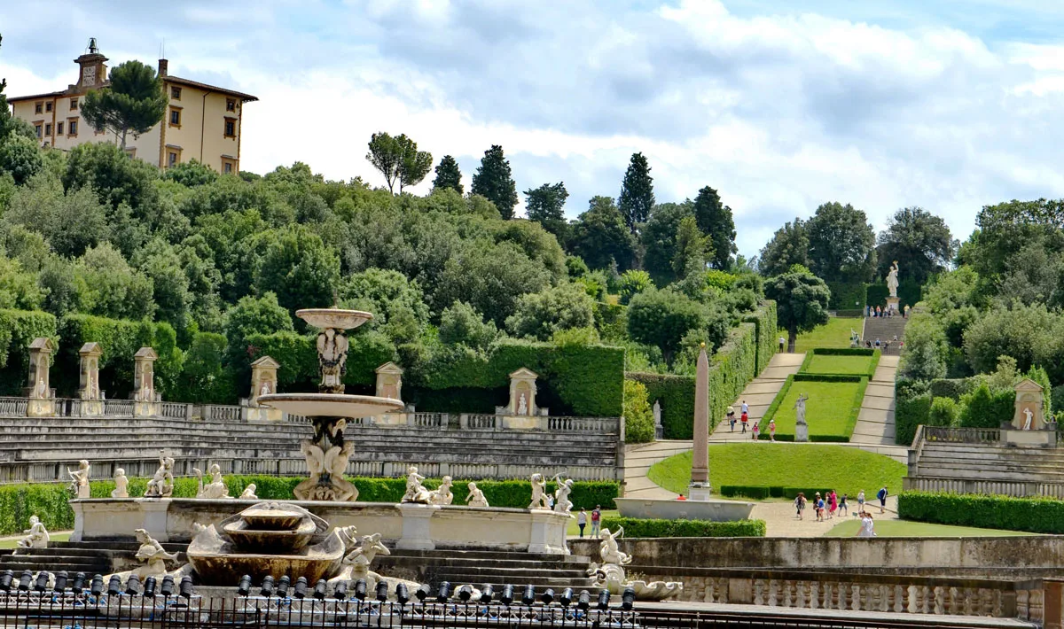 Expansive gree gardens with statues at the Pitti Palace in Florence.