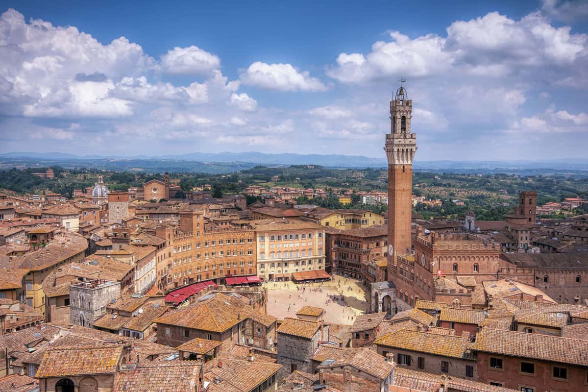 The Piazza del Campo with the Mangia tower in Siena town.