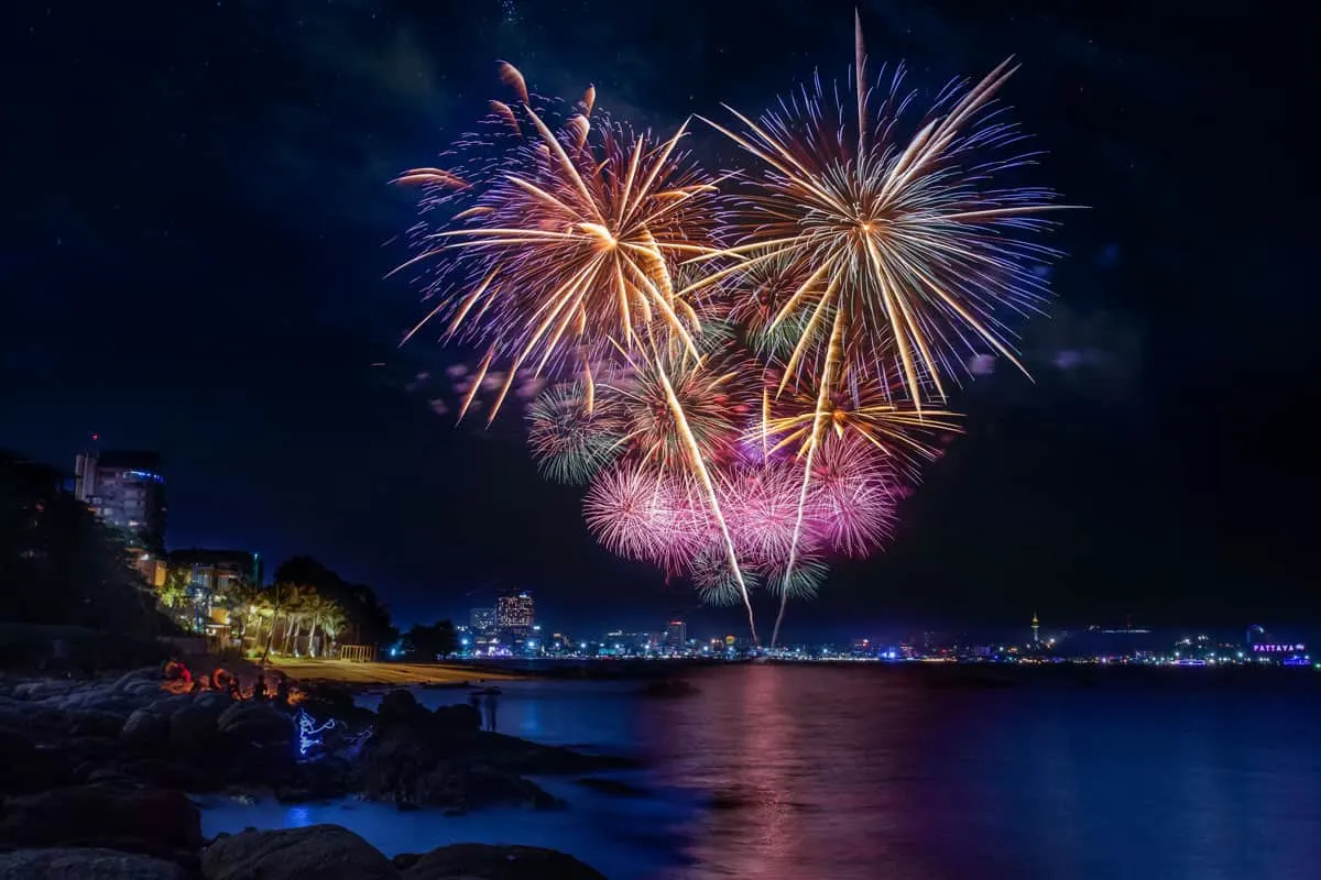 fireworks at night over a Thai beach. 