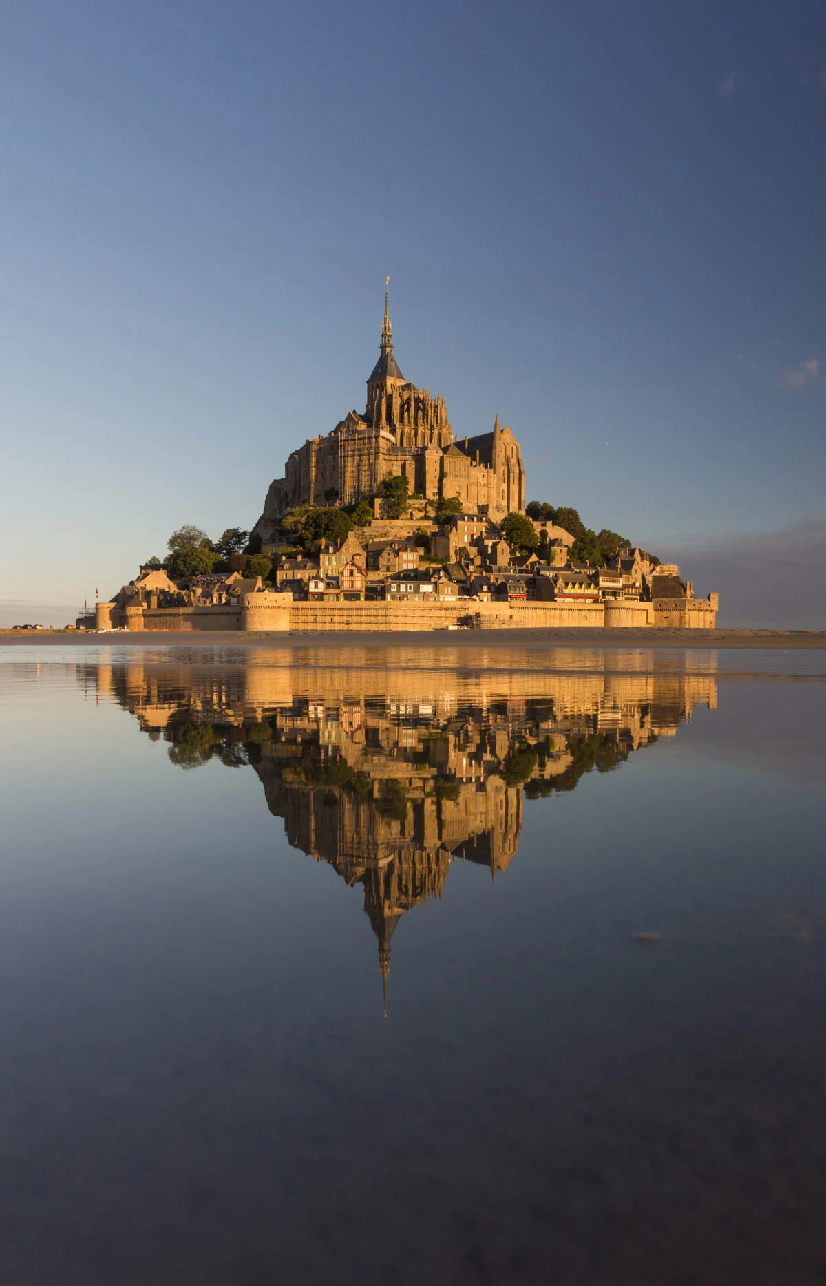 The Abbey of Mont Saint Michel reflecting in the water.