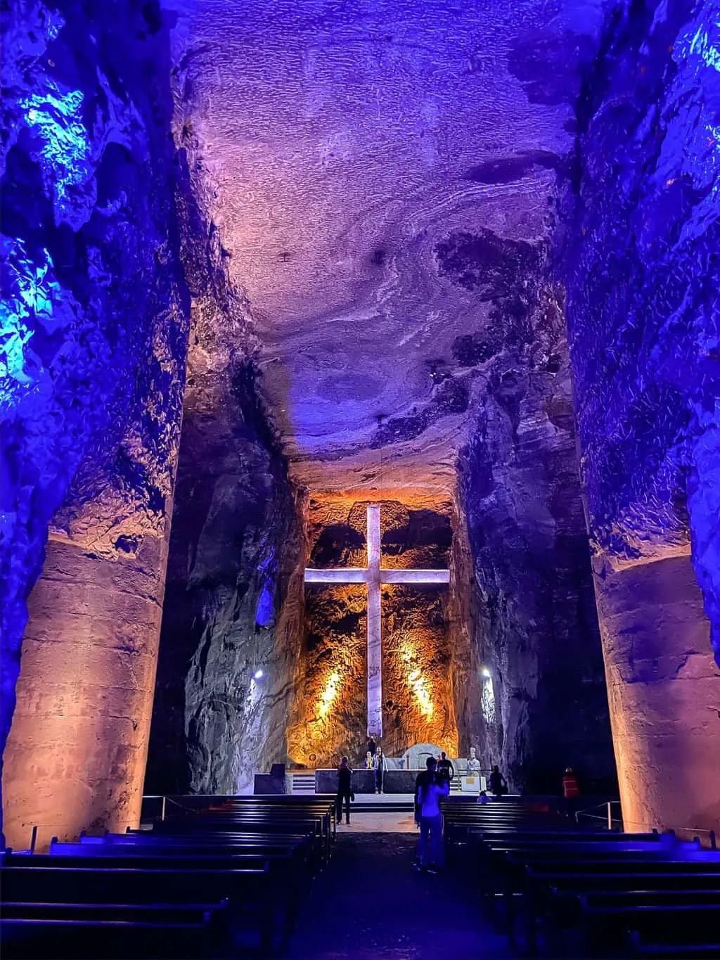 An underground cave church with purple lighting.