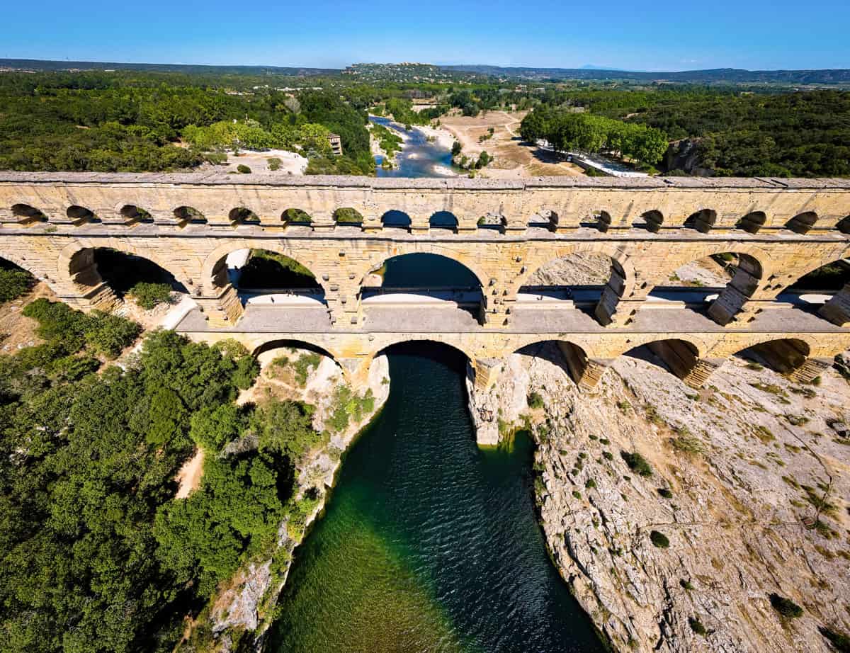 The aerial view of the Pont du Gard, an ancient tri-level Roman aqueduct bridge in France.