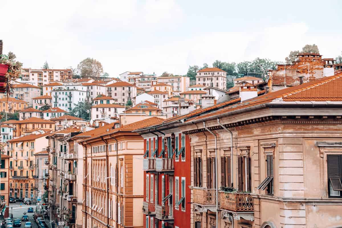 The orange hued houses and buildings in the city of La Spezia Italy.