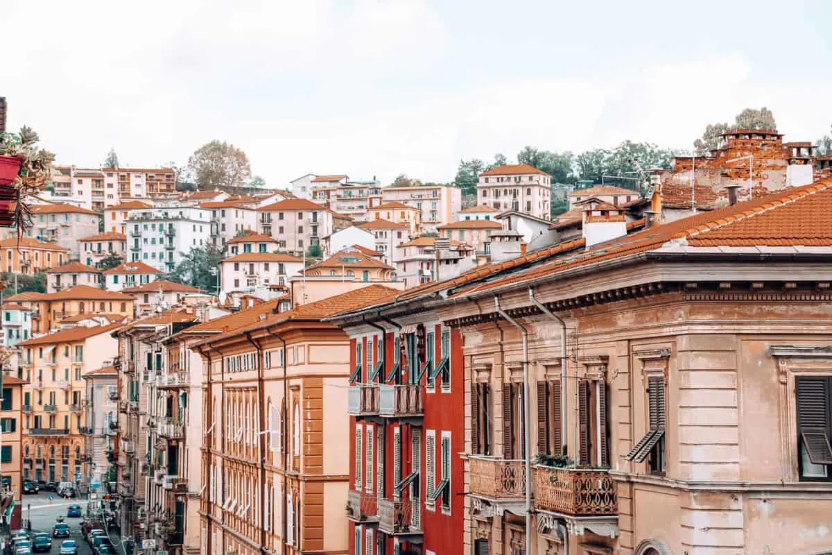The orange hued houses and buildings in the city of La Spezia Italy.