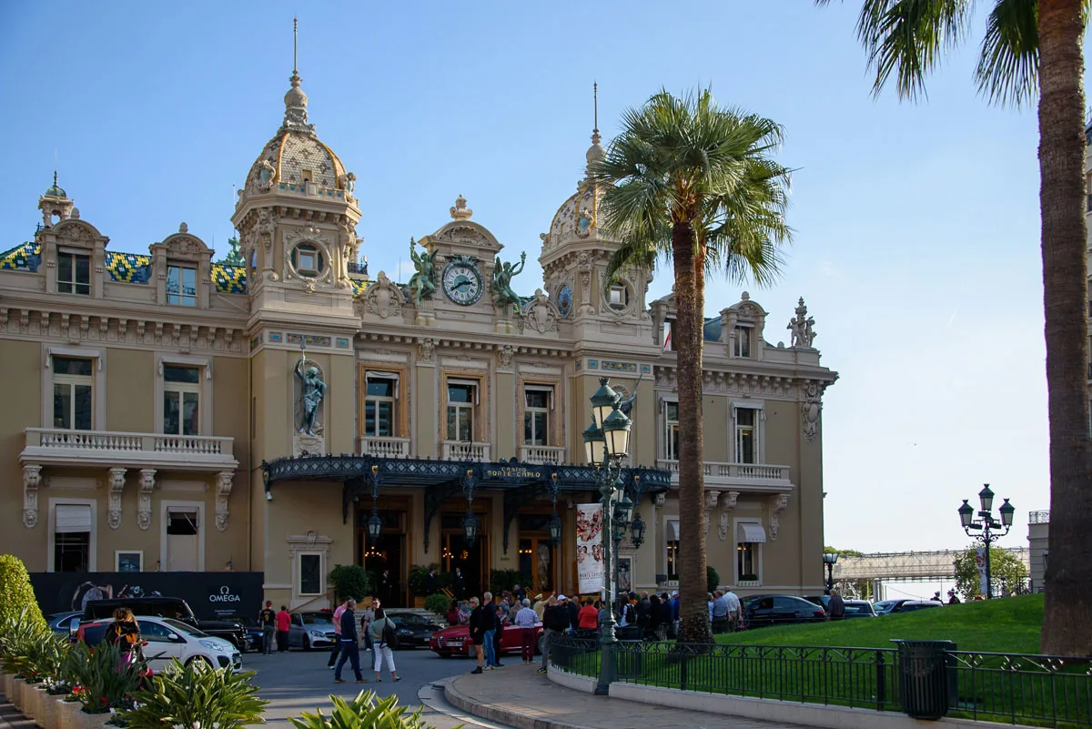 People walking in front of the famous Monte Carlo Casino in Monaco.