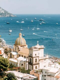 Italian town on the Amalfi coast with lots of boats out on the water.