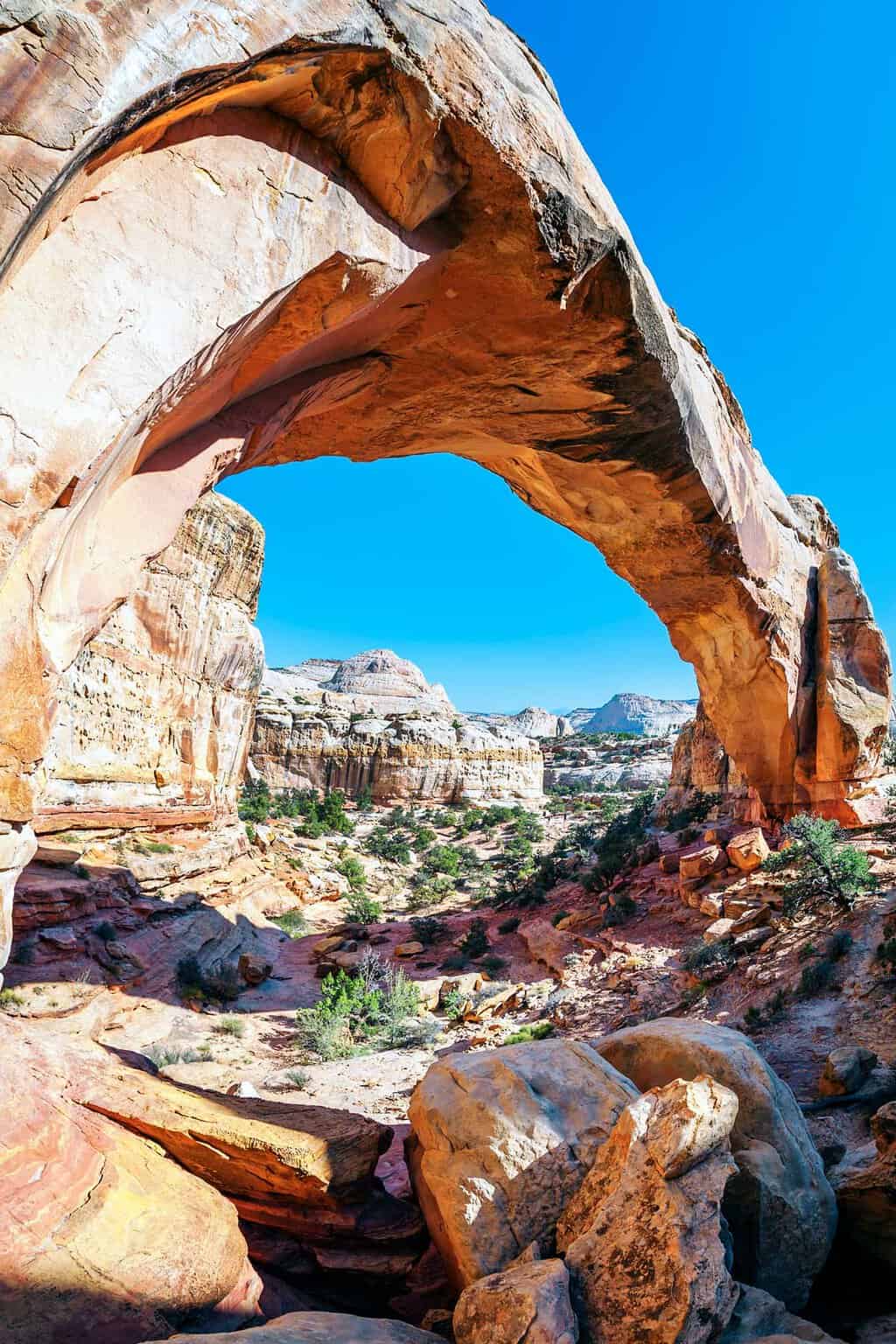 Views through a natural rock arch in Capitol Reef National park.