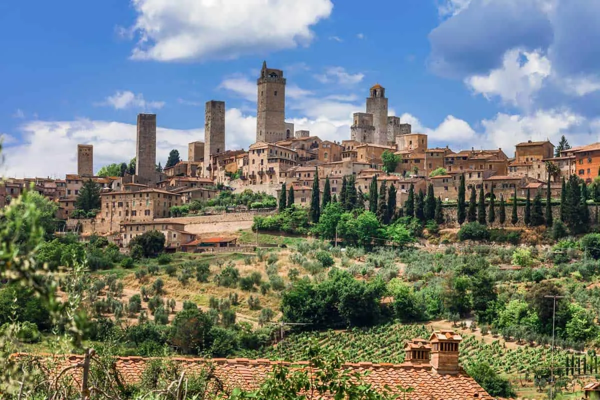 The medieval towers and the town of San Gimignano surrounded by the Tuscan countryside. 