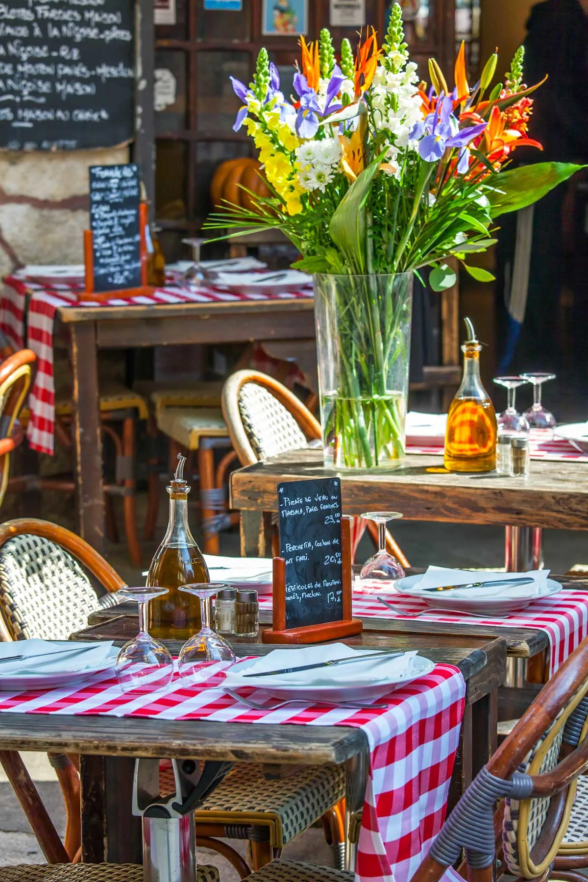 cafe tables outside a French restaurant in Nice in March.