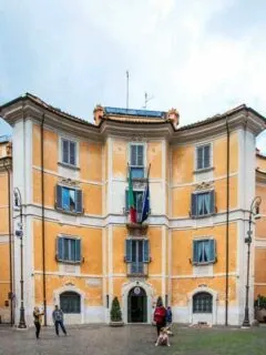 Yellow facade of obscure shaped building in Rome.