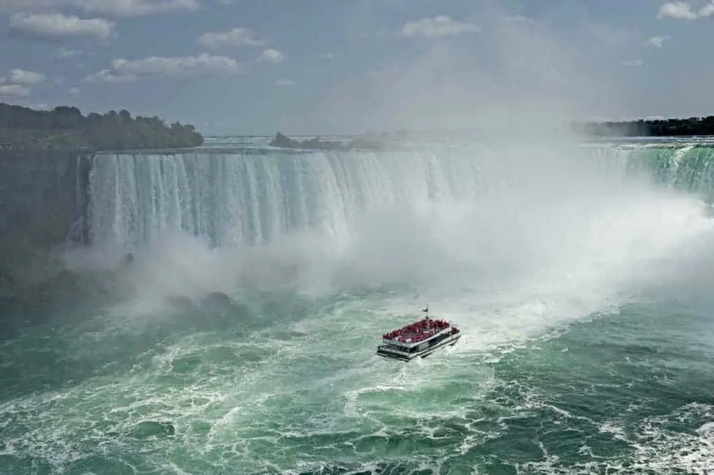 The Maid of the Mist boat under the Niagara Falls. 