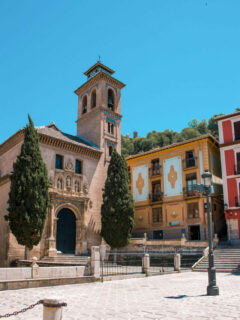 A typical plaza with a church in Granada Spain.