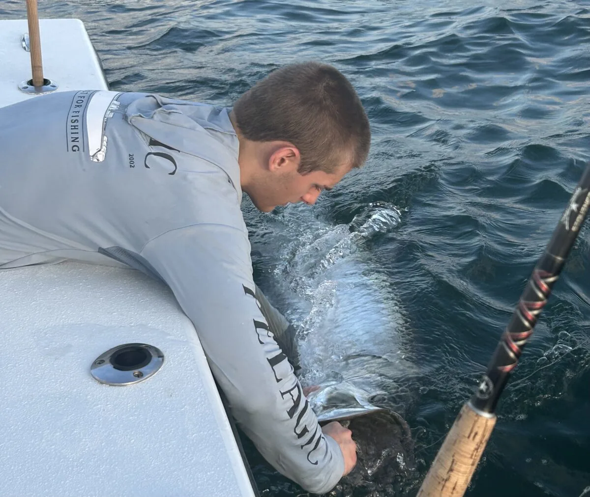 Islamorada, Florida Young man pulling a fish up 
Big catch in the Gulf