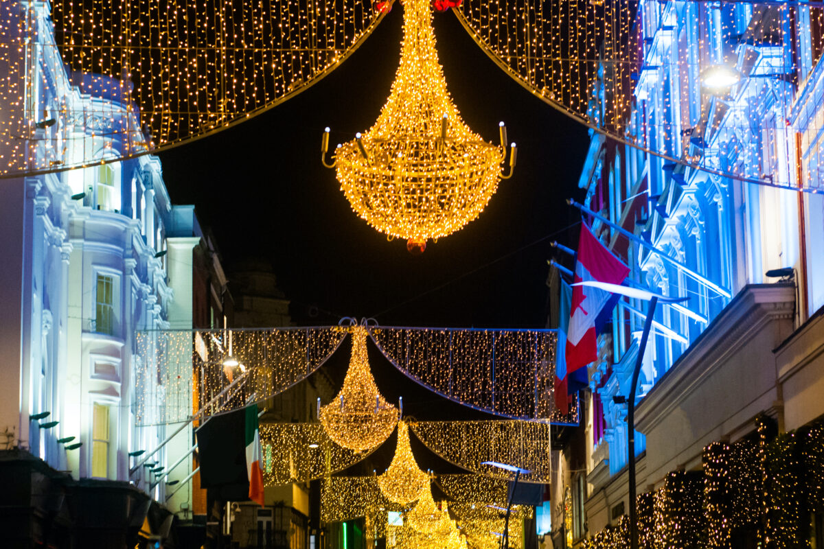 Grafton street in Dublin, Christmas lights hanging between city buildings