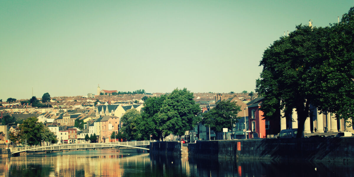 River Lee in Cork, Ireland with background of city and shops