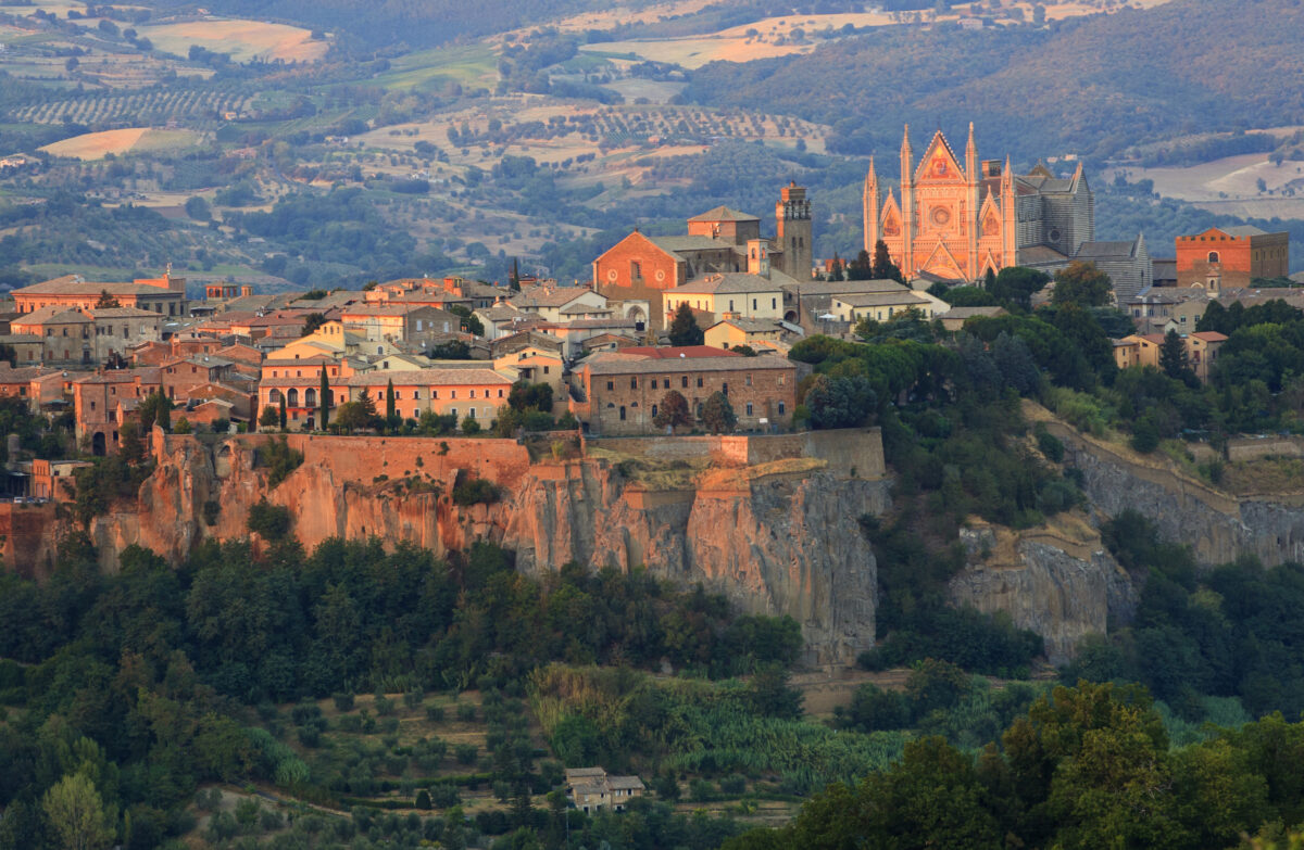 Cityscape and green hills background in Orvieto, Italy