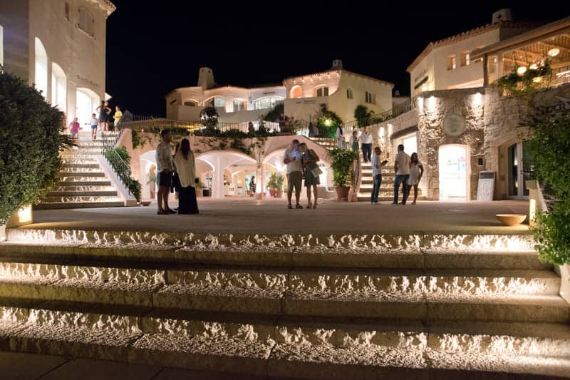People and promenade with shops in Porto Cervo, Sardinia, Italy