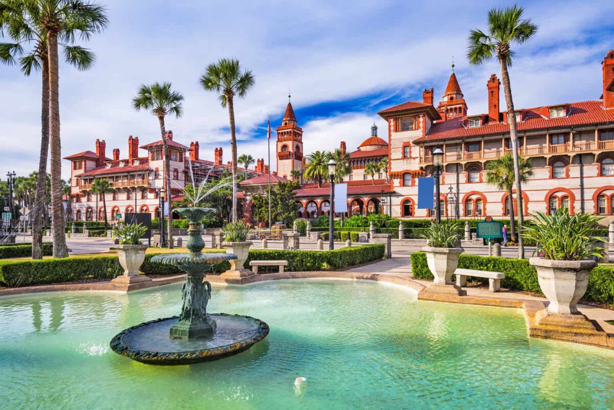 red and white buildings with a fountain and pool in St. Augustine Florida