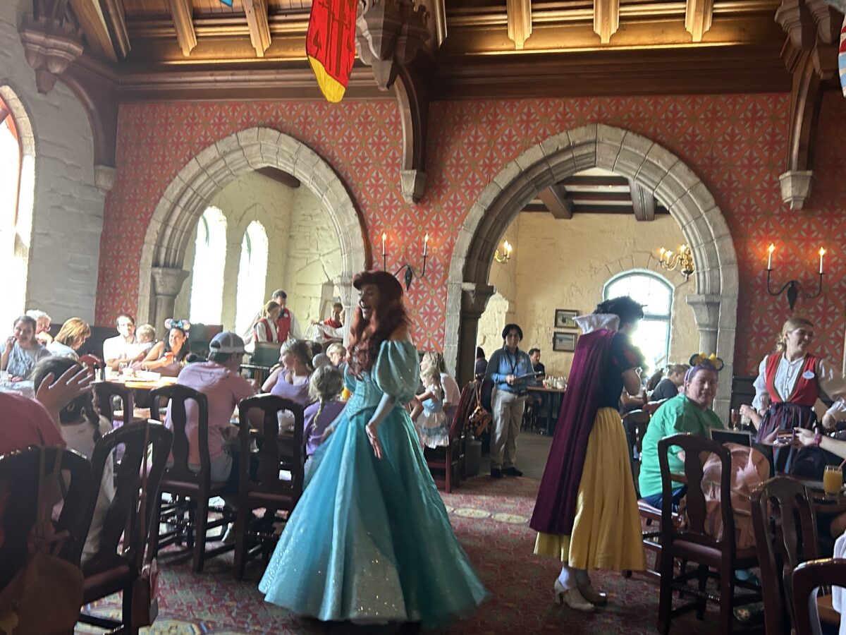 Priness breakfast at Disney World with diners eating and princesses walking around