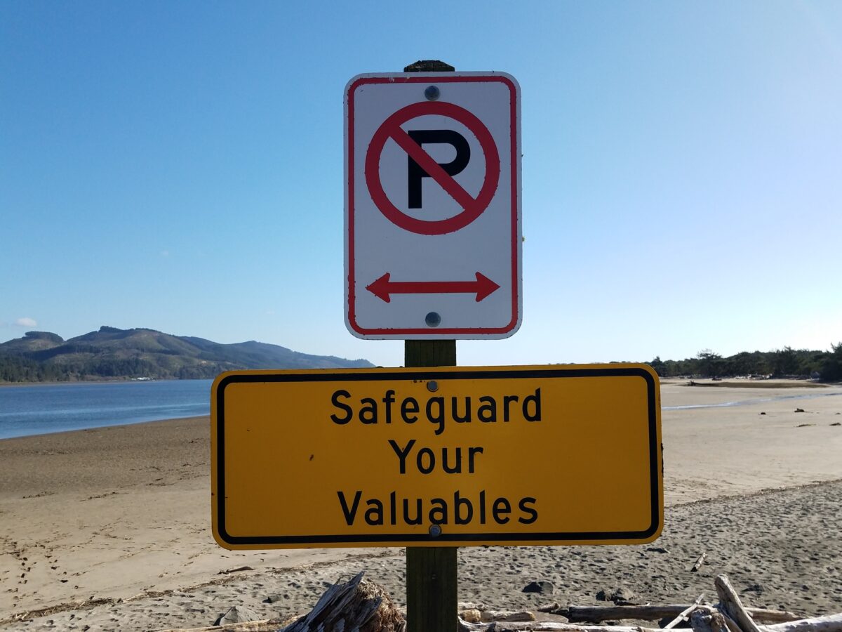 beach sign that reads "safeguard your valuables"