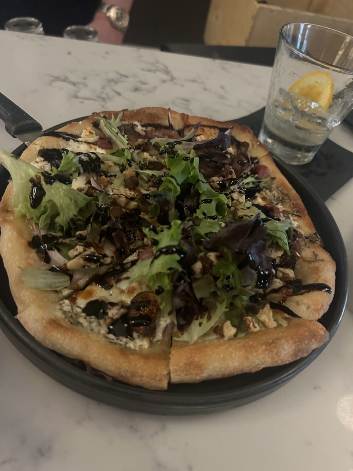 Arugala and goat cheese flatbread pizza at Tastings in Indianapolis, Indiana