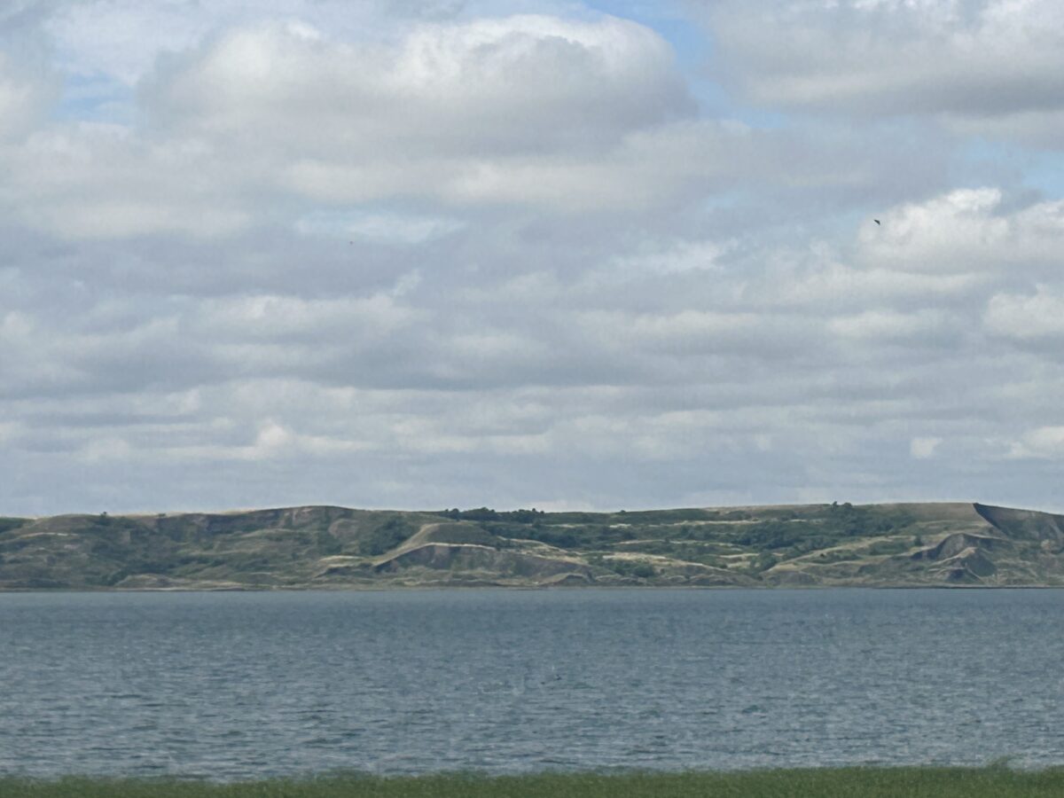 Picture of Missouri River in Mobridge South Dakota with hills in the background