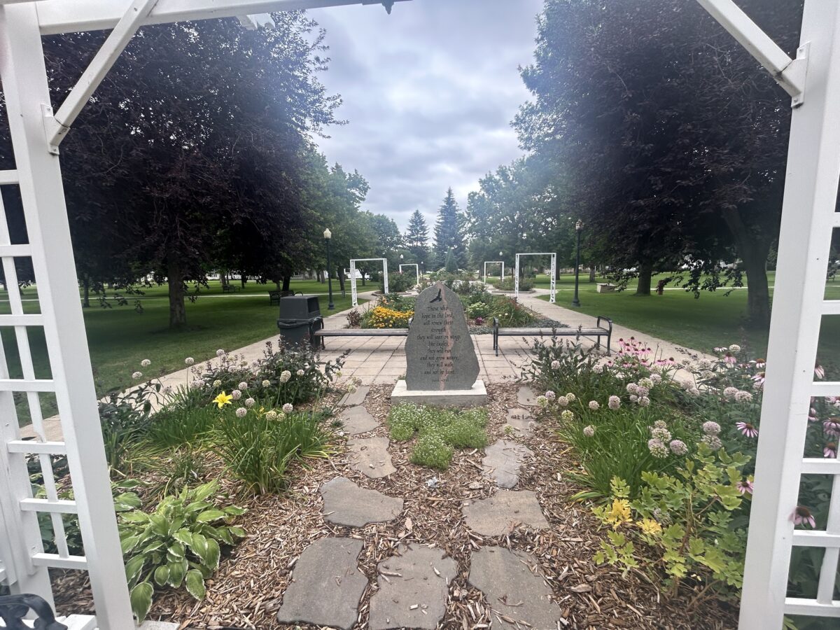 Garden park in Mobridge with stepping stones, flowers and park benches