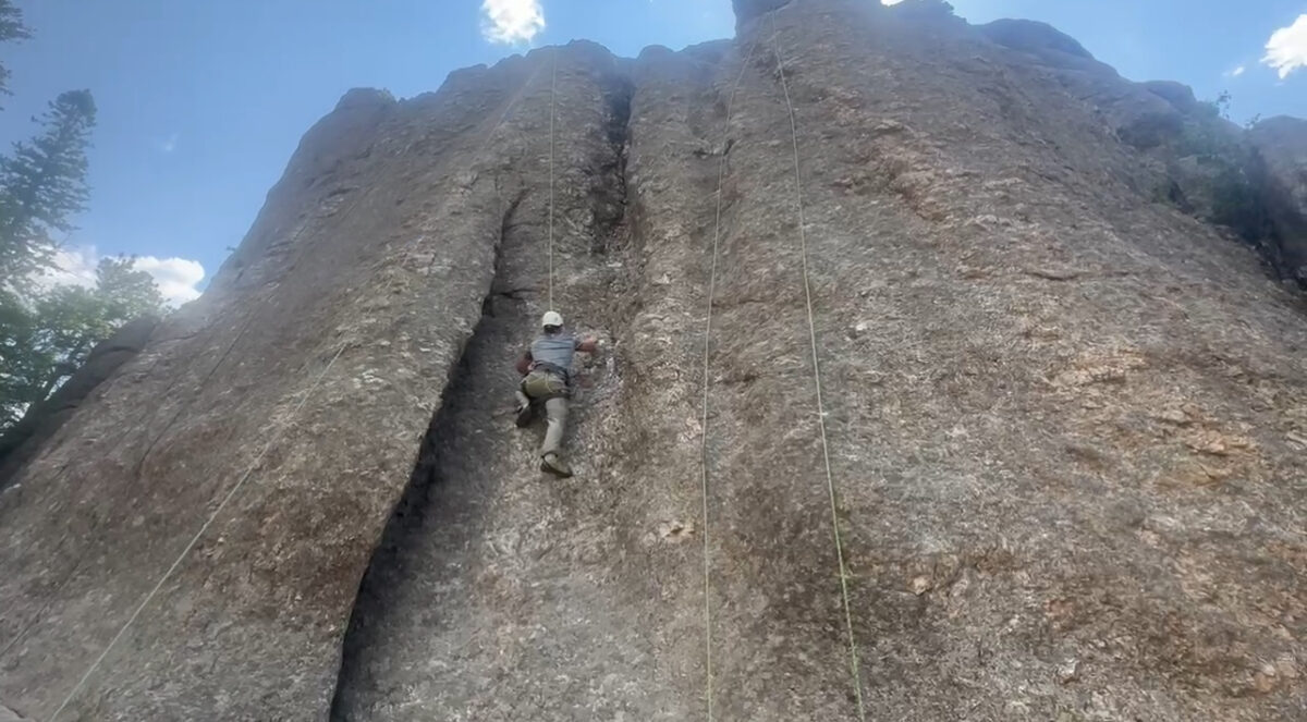 Man rock climbing at Custer Stae Park, South Dakota