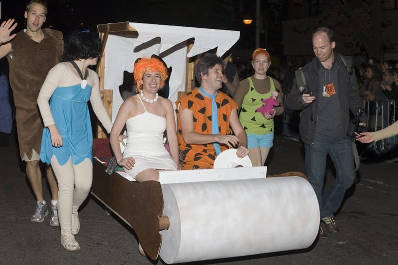 people dressed as Flinstones Halloween costume in NYC Village Halloween parade