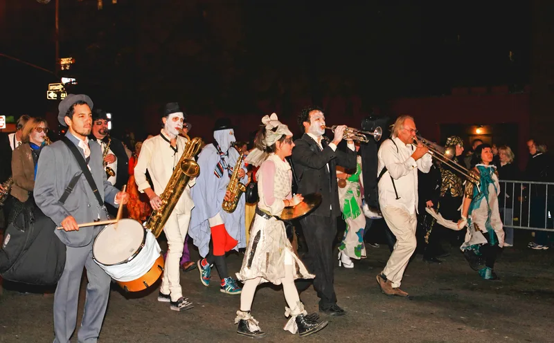 people dancing and playing music in NYC halloween parade