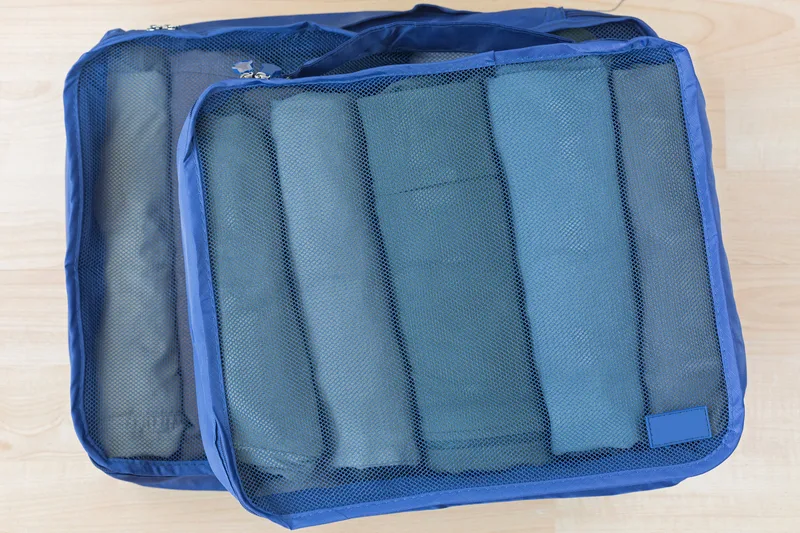 blue packing cube with towels