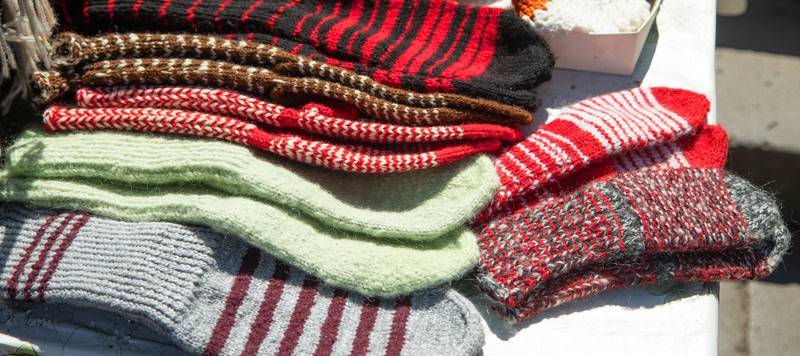 wool socks on a table for sale