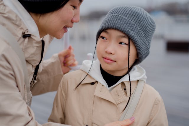 young Japanese girl in winter hat and winter jacket