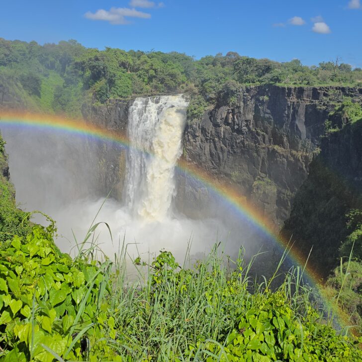 victoria falls zimbabwe with a rainbow cast over