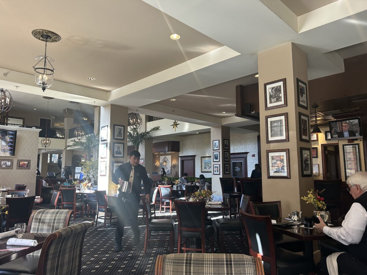 Interior of 1741 on the Terrace restaurant inside Hotel Bethlehem. Waiter with water pitcher.
